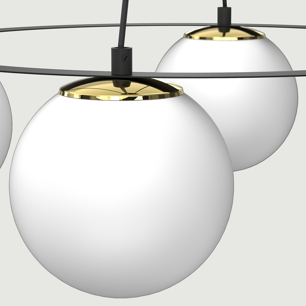 Szczególnym elementem lampy BALLO są dekoracyjne elementy w błyszczącym, złotym kolorze, które w interesujący sposób przełamują biel i czerń.