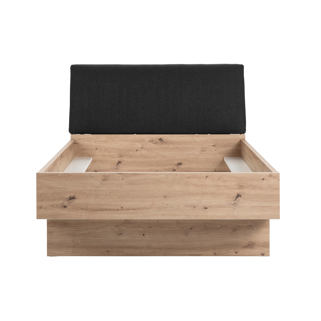 Łóżko dąb artisan z czarnym tapicerowanym wezgłowiem i szufladą.