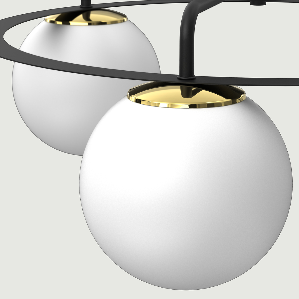 Szczególnym elementem lampy BALLO są dekoracyjne elementy w błyszczącym, złotym kolorze, które w interesujący sposób przełamują biel i czerń.